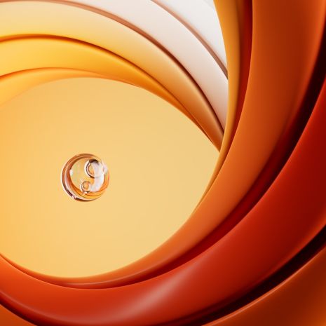 A close up of an orange and white swirl